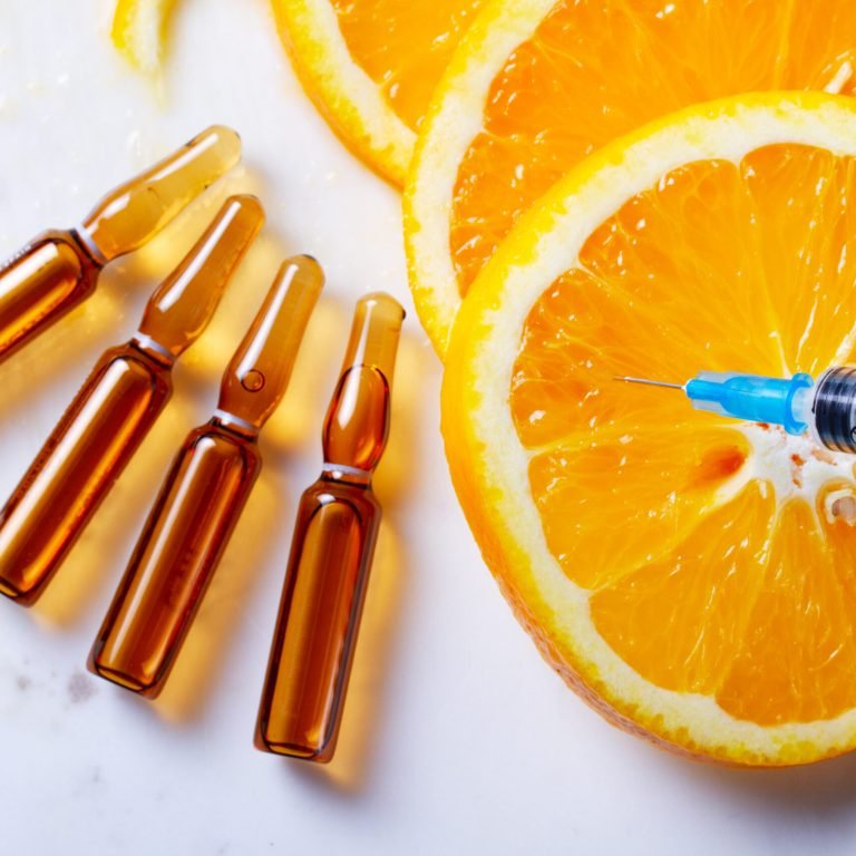 Vitamin C, natural anti aging cosmetics serum ampullas and syringe, banner